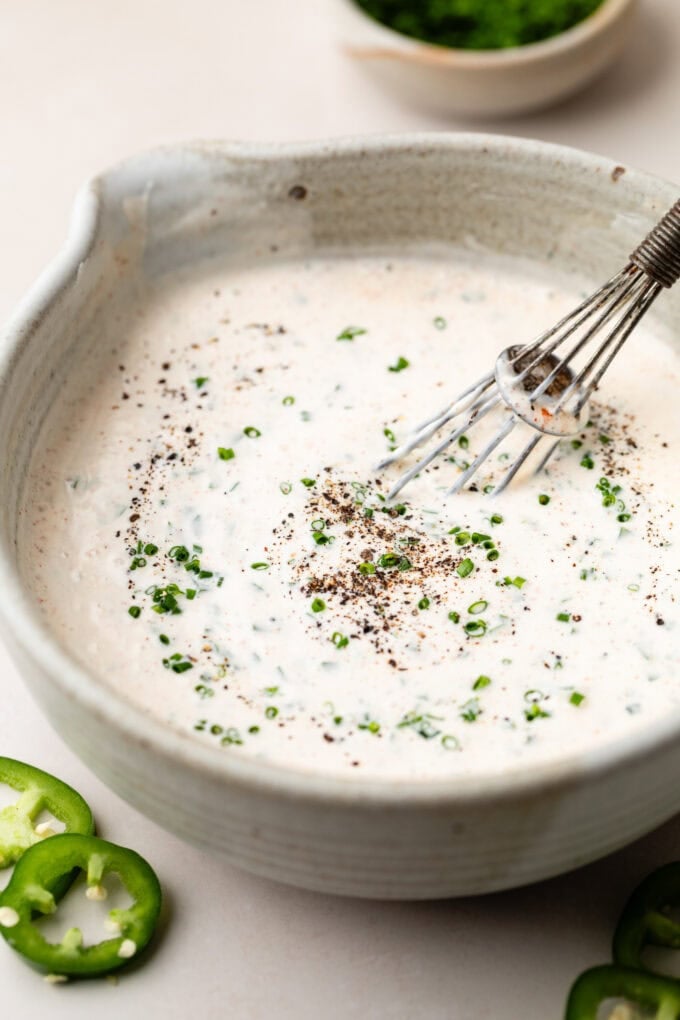 jalapeno ranch in bowl with whisk