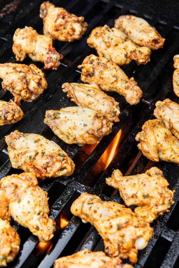 raw chicken wings on grill