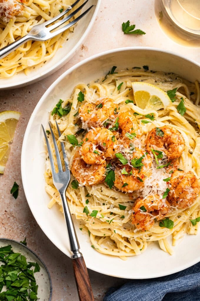 creamy pasta with shrimp in white bowl