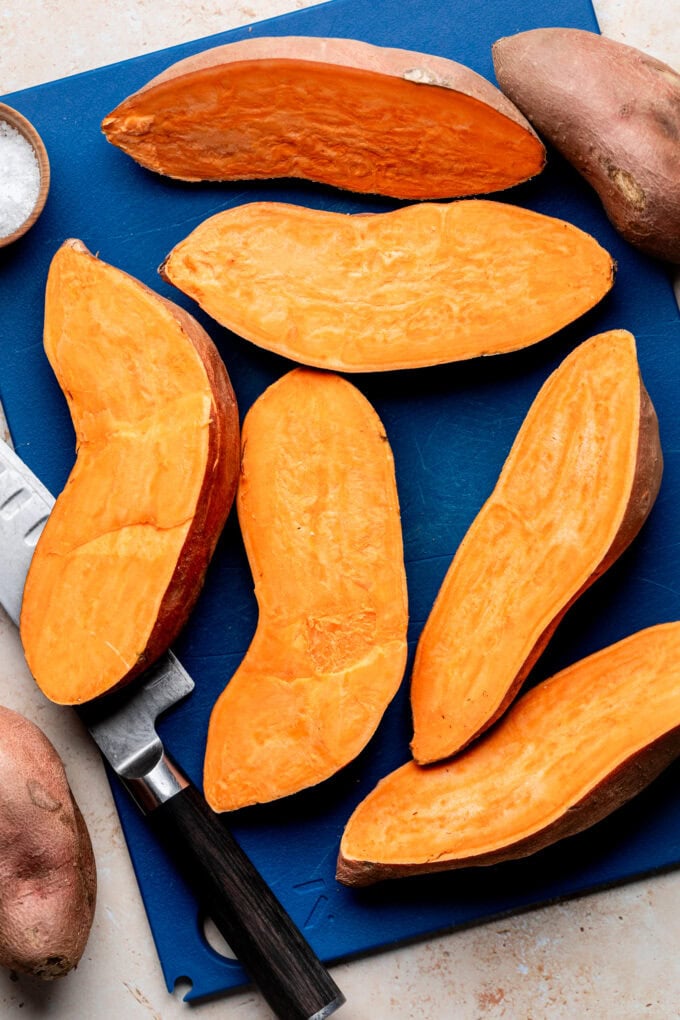 halved sweet potatoes on baking sheet