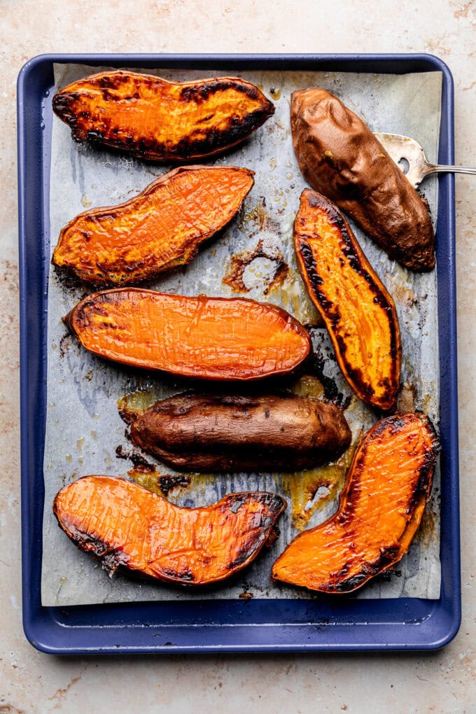 roasted sweet potato halves on baking sheet