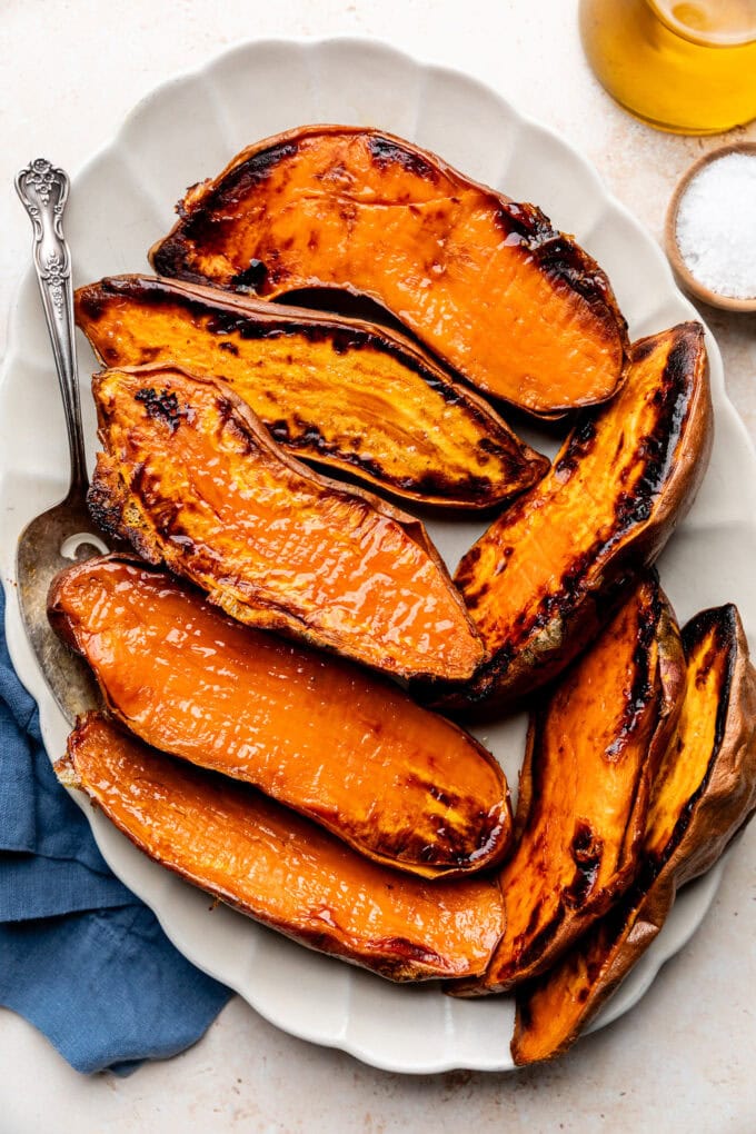 caramelized roasted sweet potato halves on platter