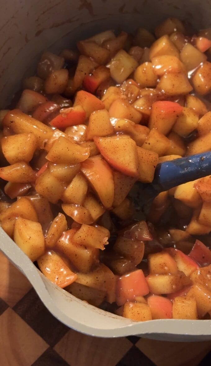 closeup of spiced chopped apples in saucepan
