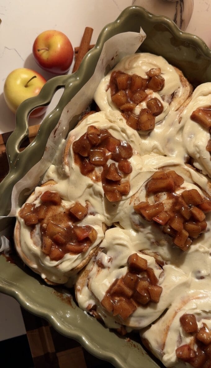 apple cinnamon rolls in green baking pan