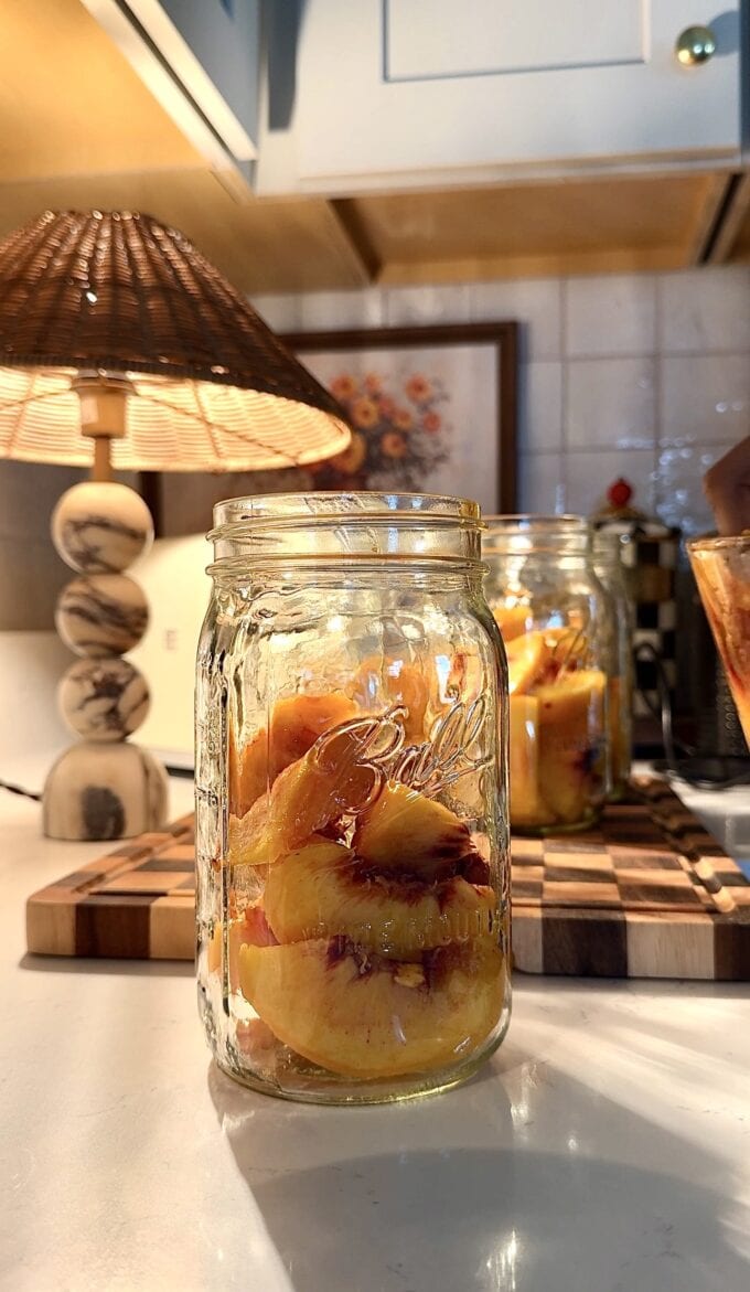 sliced peaches in mason jar