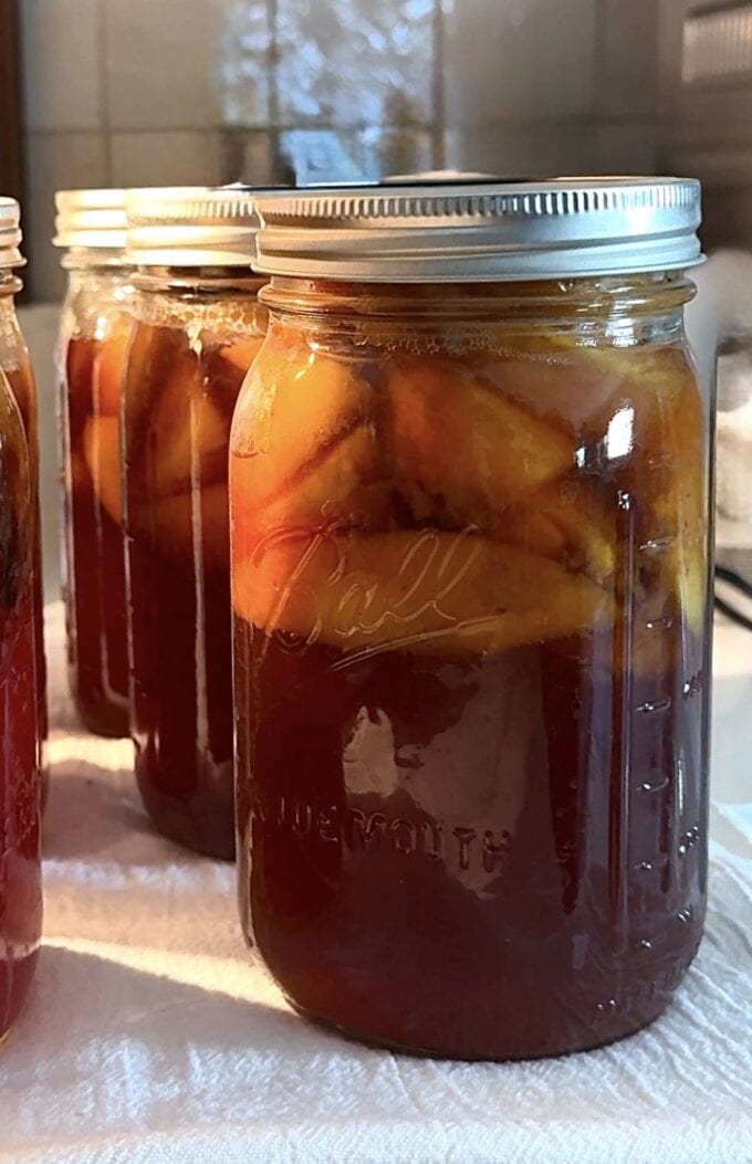 jar of sweet tea peaches